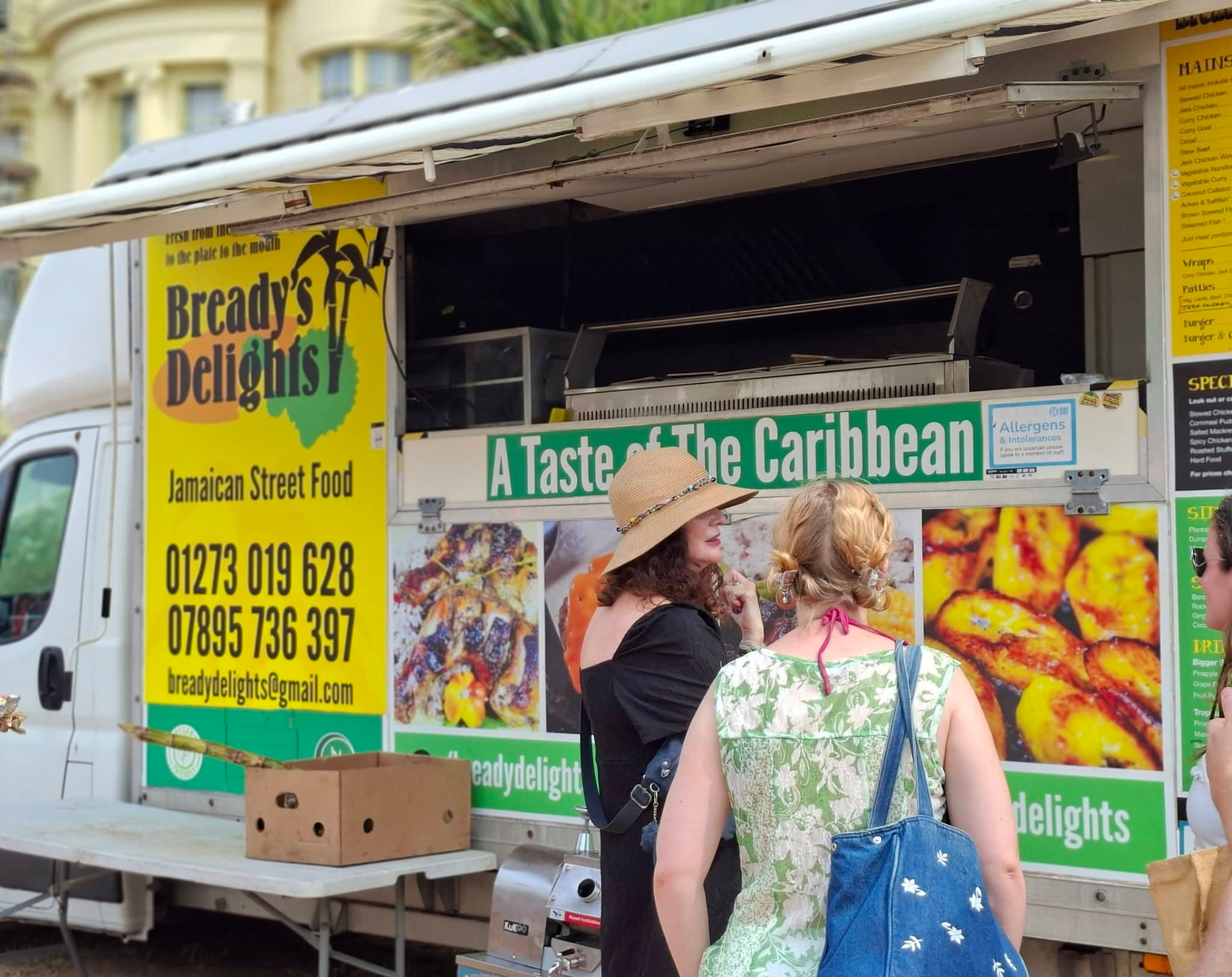 Customers being served at the Bready's Delights Jamaican food van